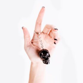 Biker-style skull keychain – rugged accessory for motorcycle keys, denim vests, or biker culture.